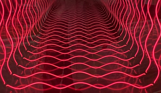 Red neon lights arranged in a pattern. Customer experience.