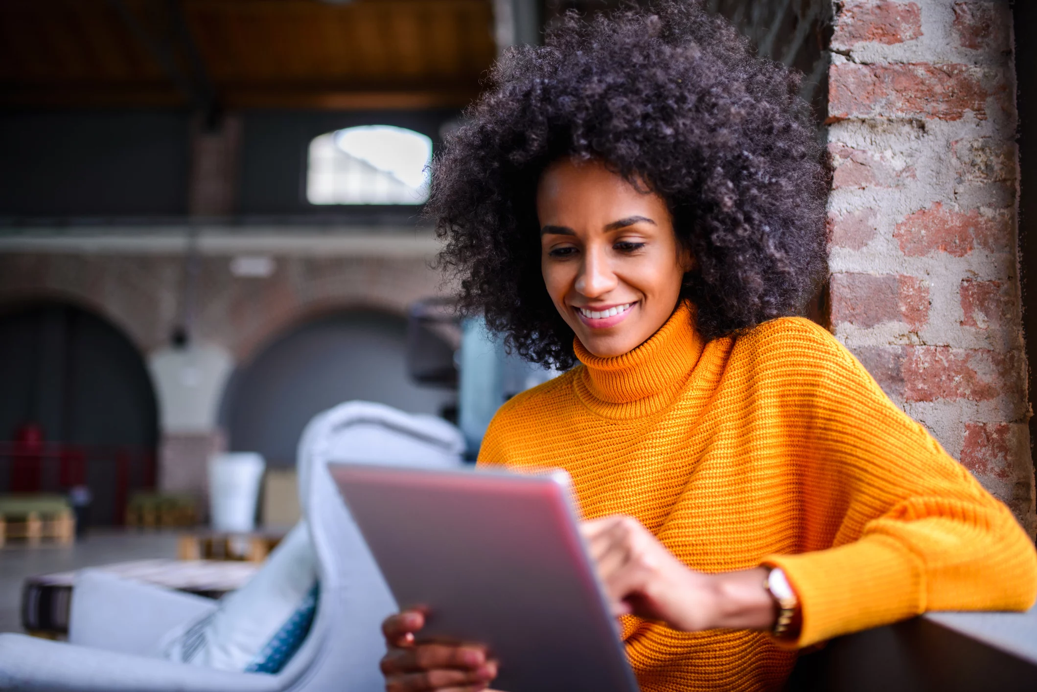 Smiling woman using digital tablet. Glasses in front of a high tech screen - win with data